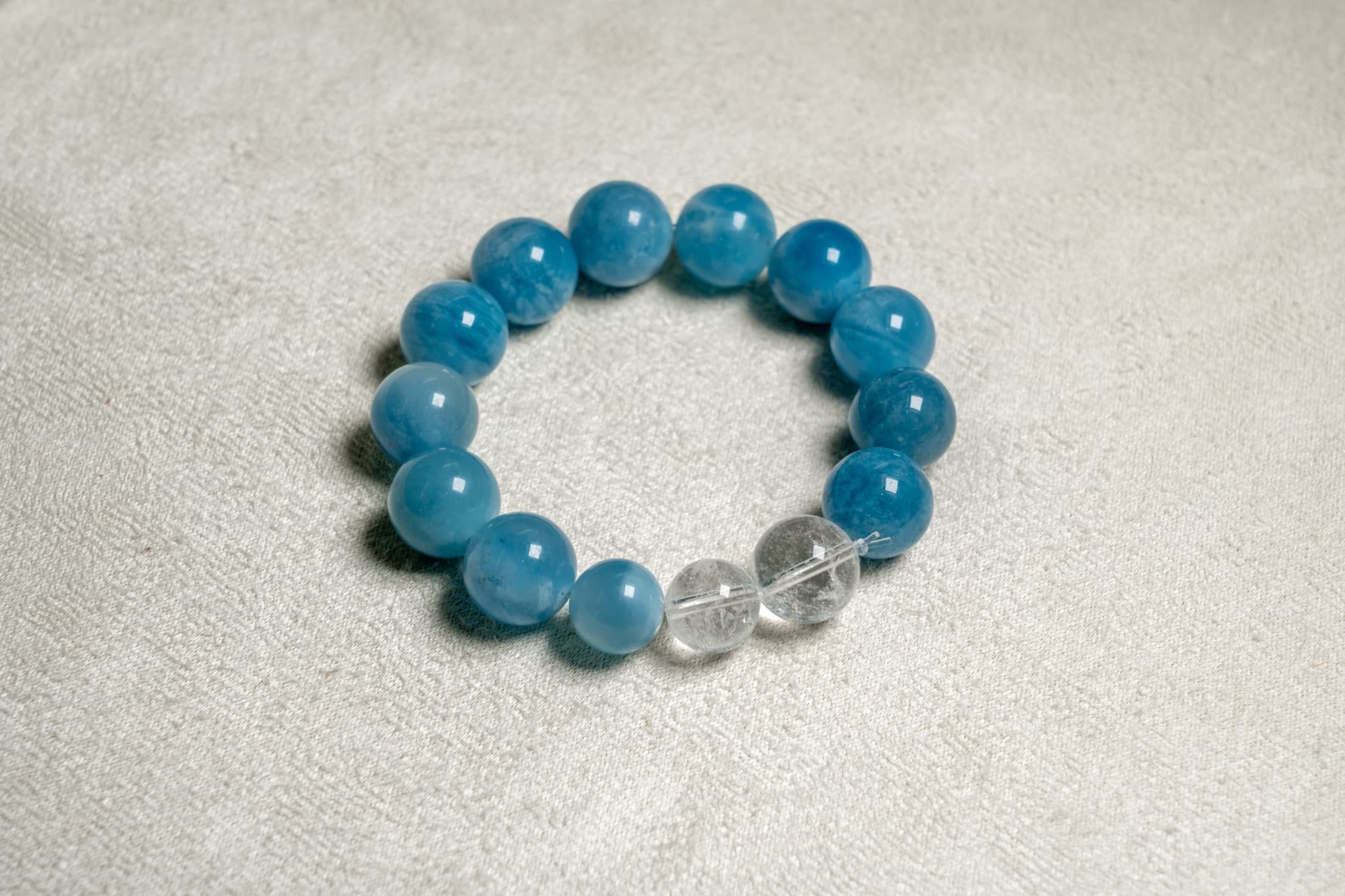 Blue natural stone bracelet arranged on linen